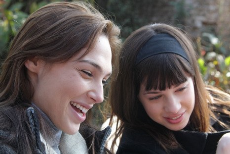 Gal Gadot and Nitzan Levratovsky in Kathmandu laughing and looking at something off screen