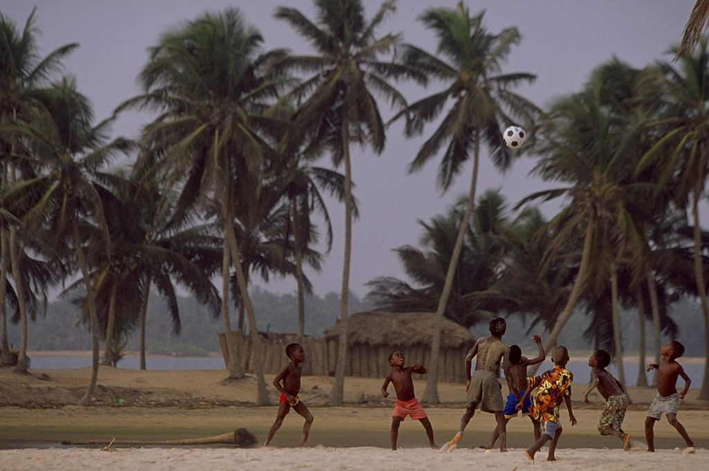 Kids playing beach football in Nigeria