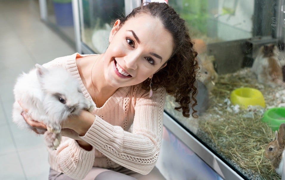 woman holding rodent