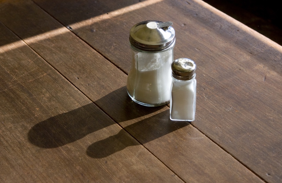 Centered on the table are a sugar and salt shaker