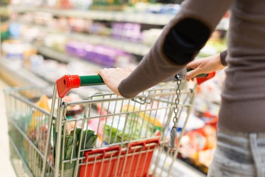 Woman grocery shopping in a supermarket