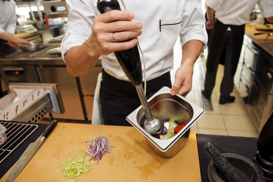chef using immersion blender