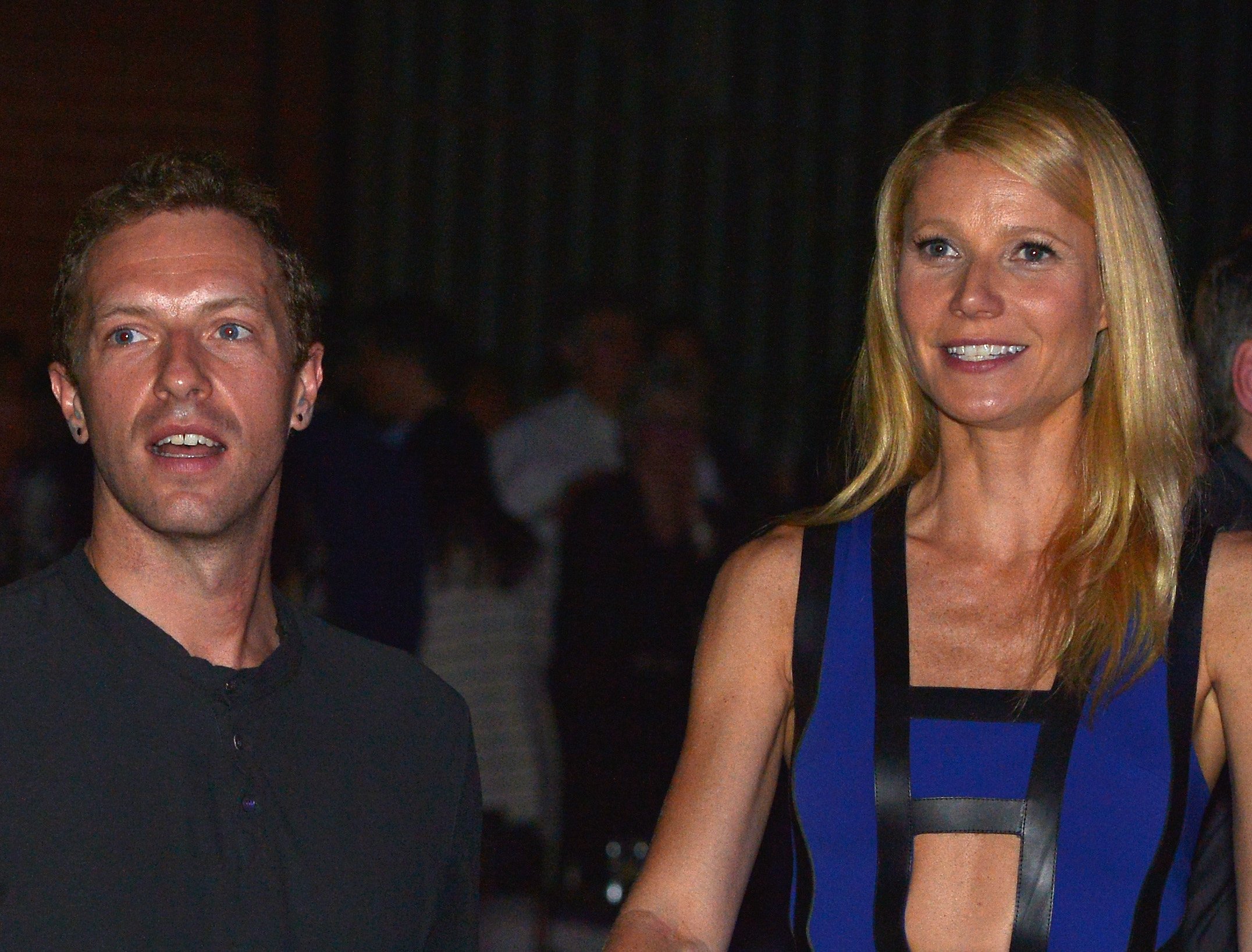 Coldplay's Chris Martin and actress Gwyneth Paltrow stand together and smile during a charity event.