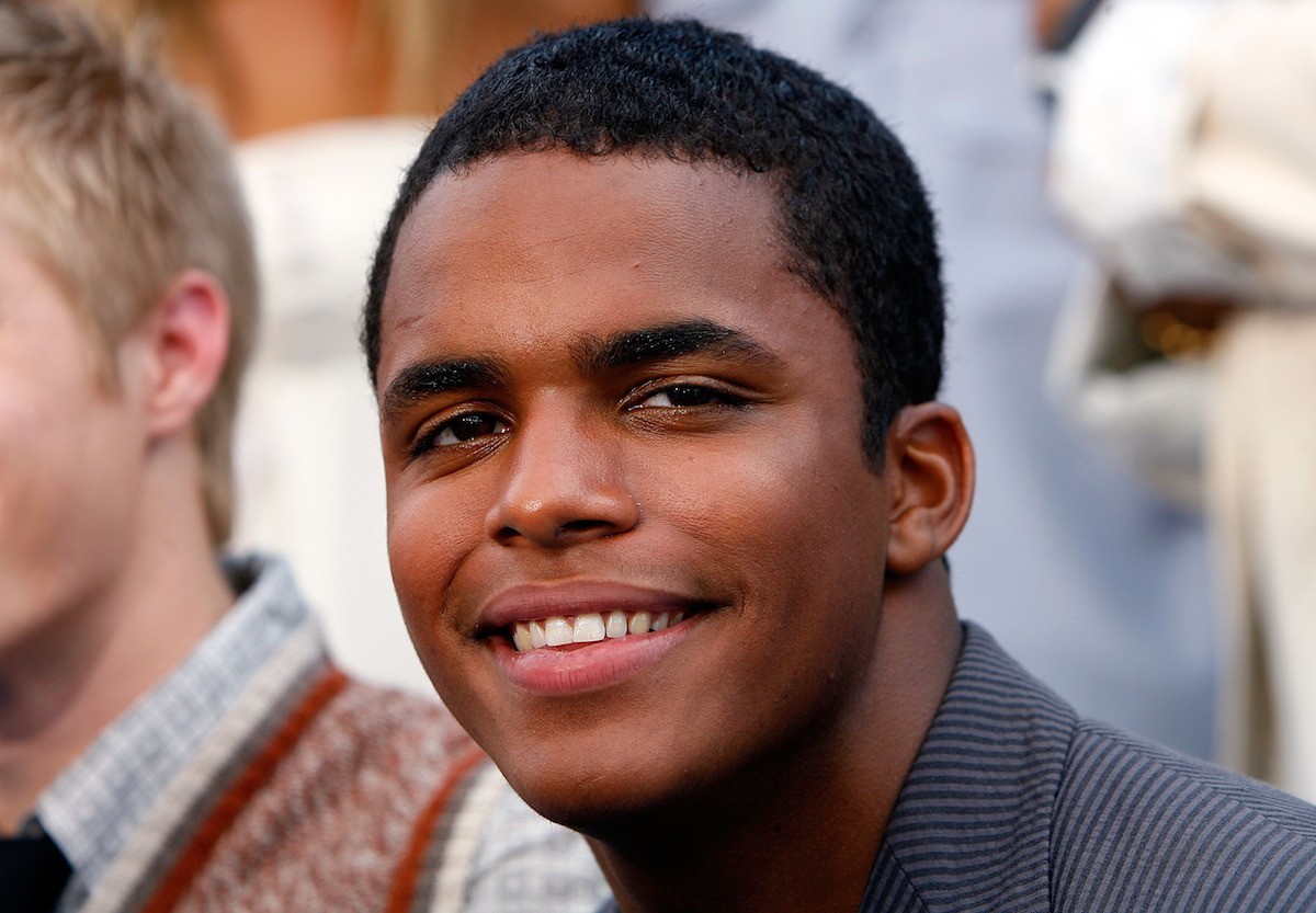 Chris Warren Jr. smiles on the red carpet at the premiere of 'High School Musical 2'