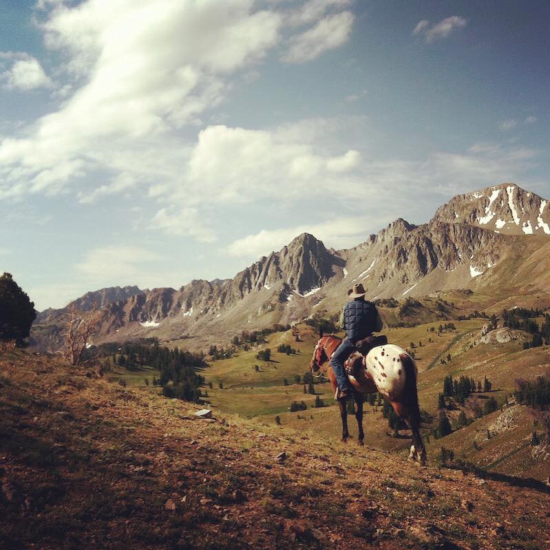 horseback riding through mountains