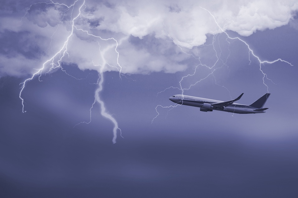 jet travelling through stormy sky