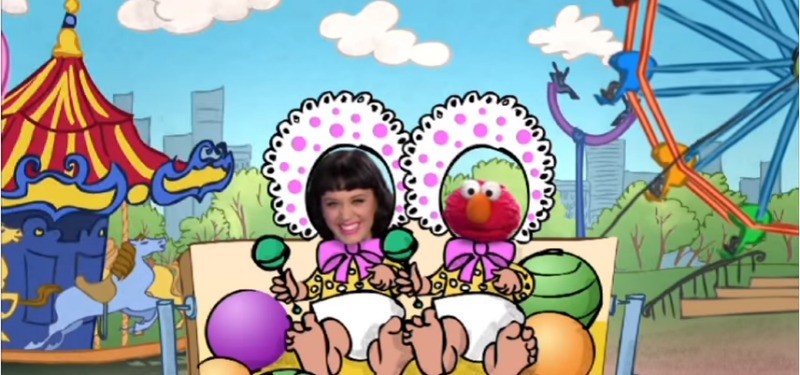 Katy Perry and Elmo are sticking their through cardboard cut outs of babies at a carnival
