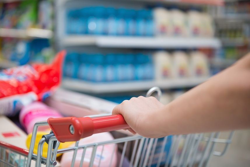 lady shopping with a full filled cart