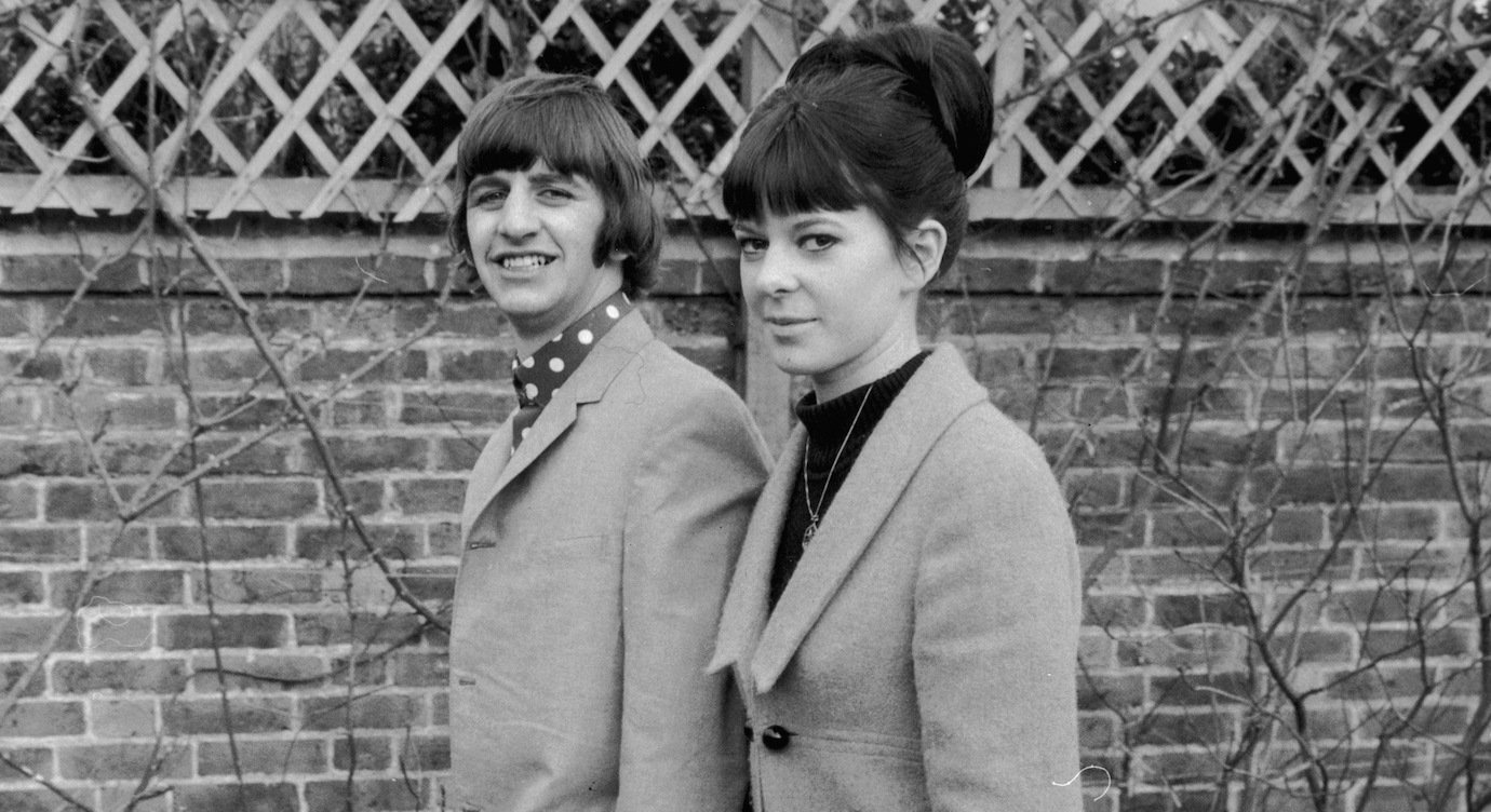 Ringo Starr walks hand-in-hand with his first wife, hairdresser Maureen Cox, in 1965.