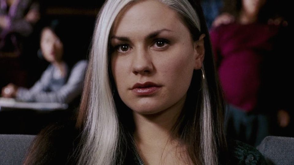 Anna Paquin as Rogue looking on