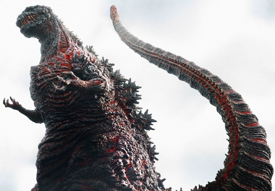 Godzilla, with red, heated parts of his scaled skin strewn across his body