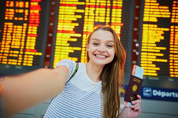 Beautiful young tourist girl in international airport
