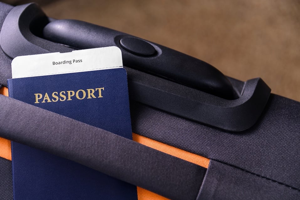 Boarding pass and a passport on a suitcase