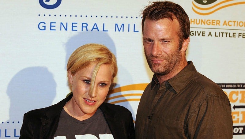 Patricia Arquette and Thomas Jane pose together on the red carpet.