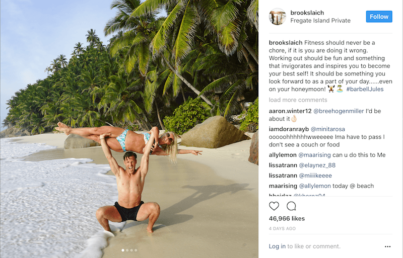 Brooks Laich lifts Julianne Hough over his head while on a beach