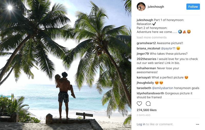 Julianne Hough and Brooks Laich pose between palm trees during their beach honeymoon 