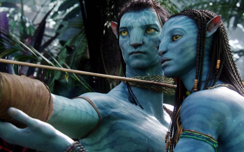 Jake Sully drawing his bow back, with Neytiri standing close to instruct him Jake Sully drawing his bow back, with Neytiri standing close to instruct him