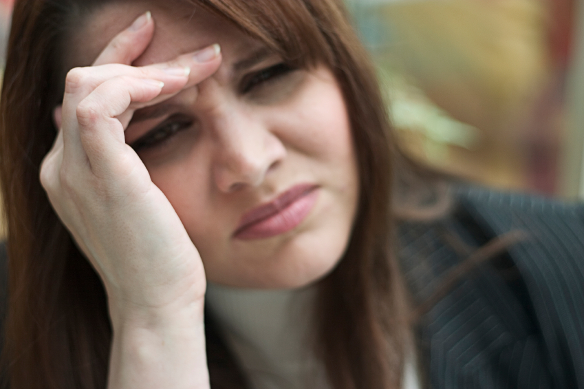 A woman with a headache A woman with a headache