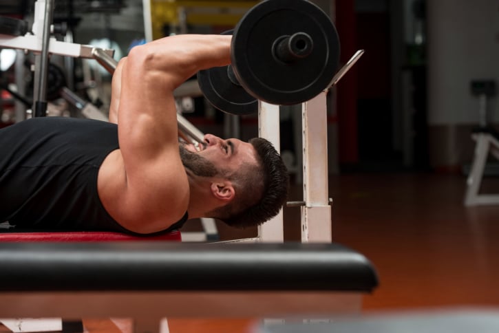 man lifting weights at the gym as an exercise alternative