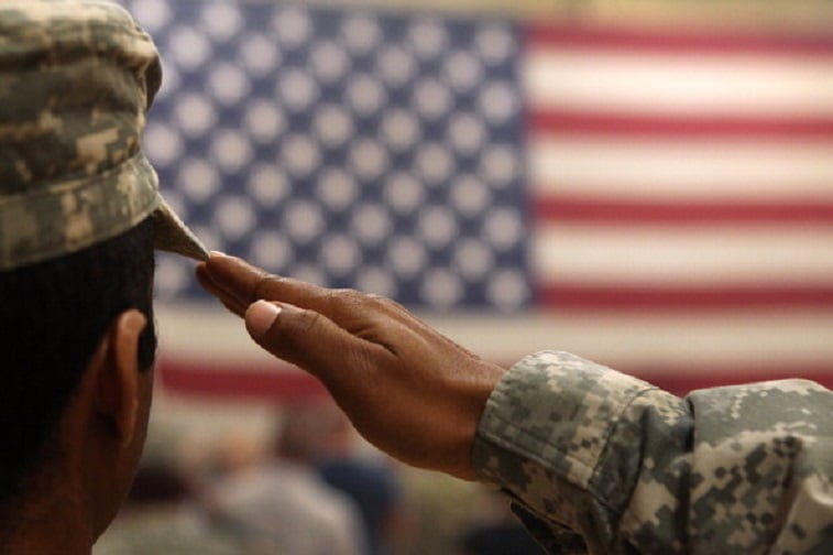 soldier saluting the American flag