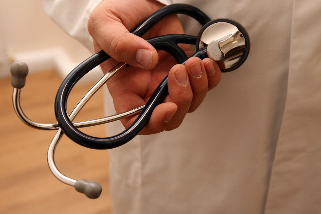 A doctor holds a stethoscope on September 5, 2012 in Berlin, Germany. Doctors in the country are demanding higher payments from health insurance companies (Krankenkassen). Over 20 doctors' associations are expected to hold a vote this week over possible strikes and temporary closings of their practices if assurances that a requested additional annual increase of 3.5 billion euros (4,390,475,550 USD) in payments are not provided. The Kassenaerztlichen Bundesvereinigung (KBV), the National Association of Statutory Health Insurance Physicians, unexpectedly broke off talks with the health insurance companies on Monday. (Photo by Adam Berry/Getty Images)