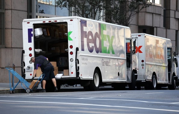 FedEx trucks on the job
