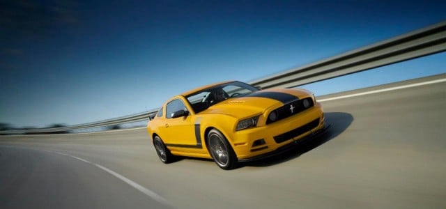A yellow 2013 Ford Mustang Boss 302
