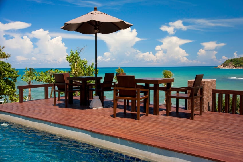 tables and swimming pool on the ocean