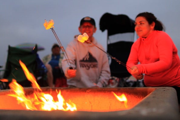 toasting marshmallows over a fire