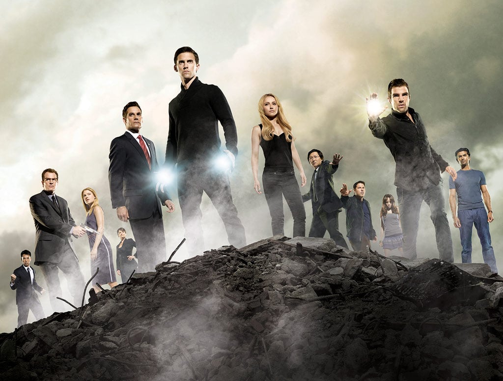 The cast of heroes standing next to one another surrounded by fog. The cast of heroes standing next to one another surrounded by fog.