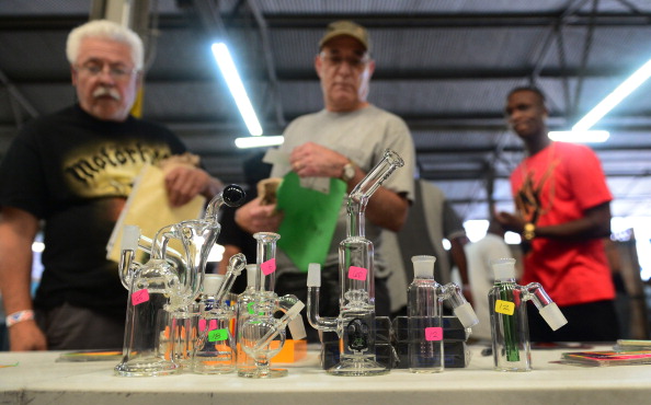 Customers check out an assortment of pipes and glass