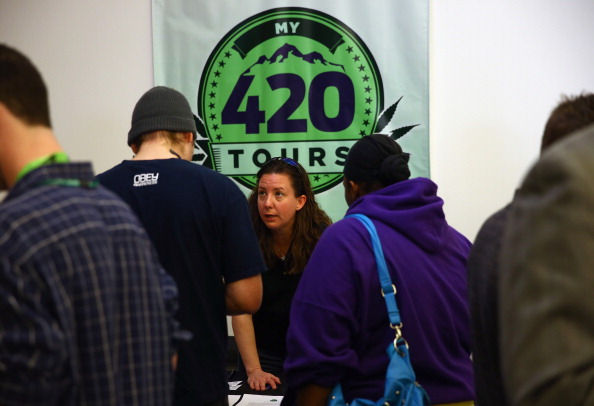 A marijuana tour operator talks to customers