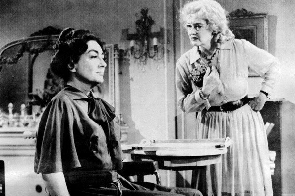 A black-and-white photo of Joan Crawford and Bette Davis in Whatever Happened to Baby Jane?