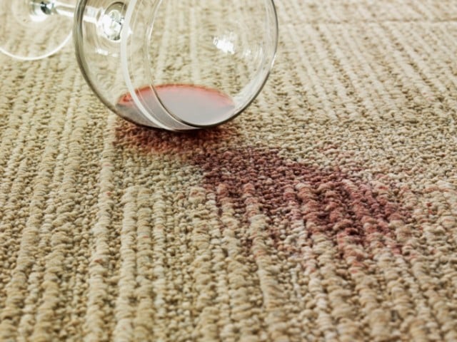 a tipped over glass of wine