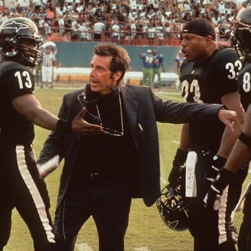 Football players fight on a field in a scene fromAny Given Sunday