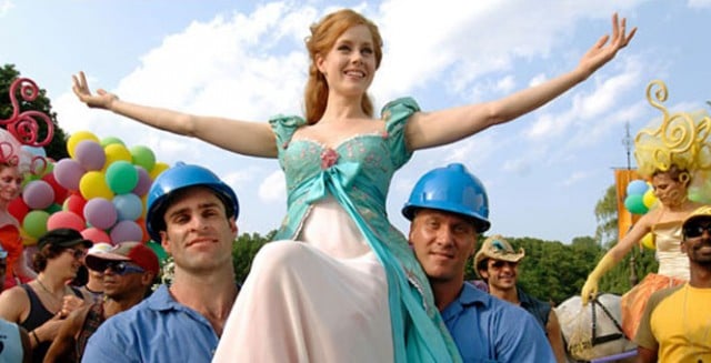 Giselle is lifted by two construction workers. Giselle is lifted by two construction workers.
