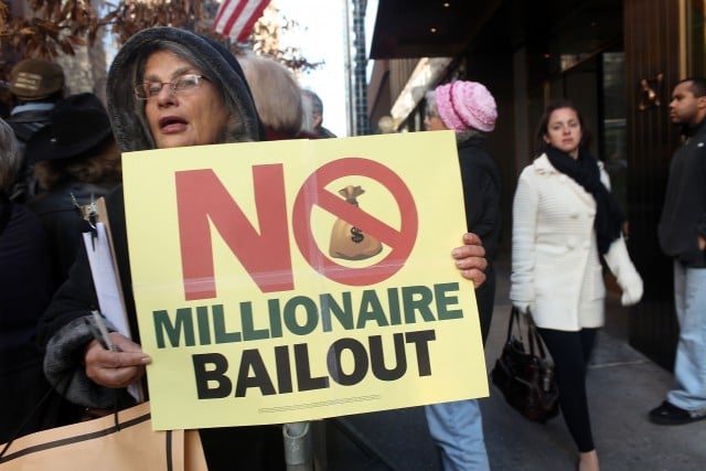People attend a rally against bank bailouts