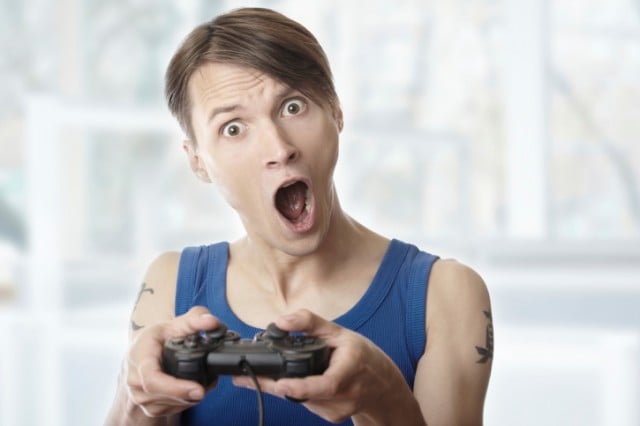 Man looking surprised while playing video games