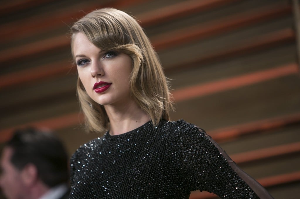 Taylor Swift posing in a black dress. Taylor Swift posing in a black dress.