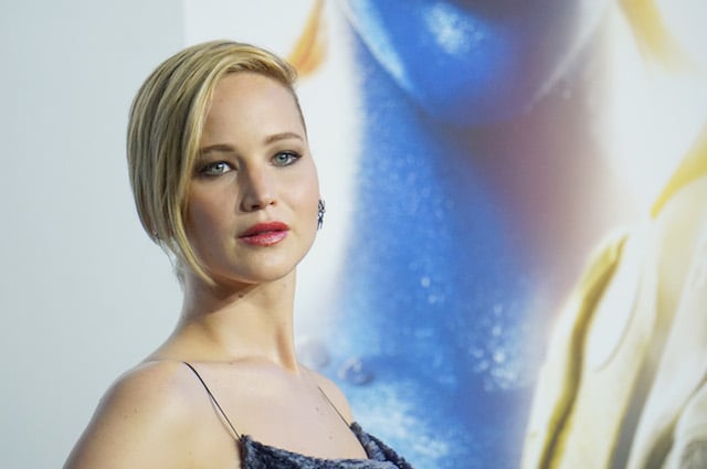 Jennifer Lawrence wears a blue dress while at a movie premiere. 