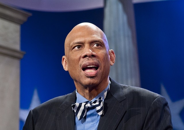 Kareem Abdul-Jabbar speaking while sitting town. Kareem Abdul-Jabbar speaking while sitting town.