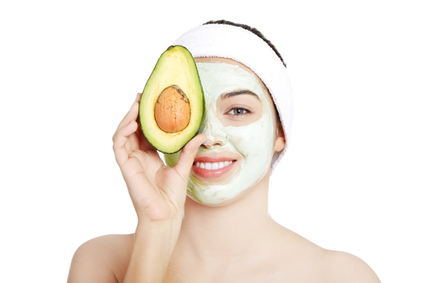 Woman wearing an avocado face mask Woman wearing an avocado face mask