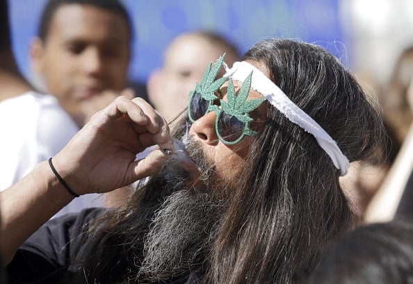 Man smoking marijuana at a festival Man smoking marijuana at a festival