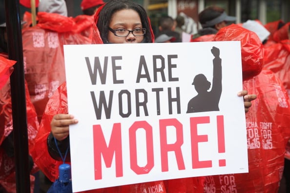 CHICAGO, IL - MAY 15: Fast food workers and activists demonstrate outside McDonald's downtown flagship restaurant on May 15, 2014 in Chicago, Illinois. The demonstration was one of several nationwide calling for wages of $15 per hour and better working conditions for fast food workers. | Photo by Scott Olson/Getty Images