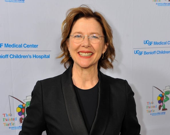Annette Bening smilles at the camera while attending an event