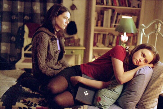 Lorelei and Rory sitting in a bedroom. Lorelei and Rory sitting in a bedroom.