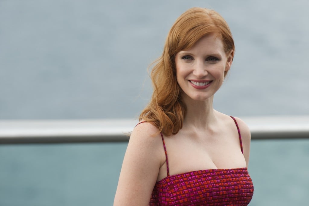 Jessica Chastain smiles in a red dress