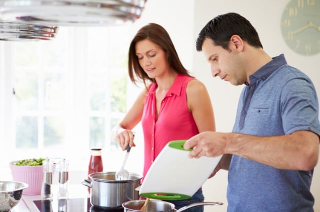 Man and woman cook dinner together Man and woman cook dinner together