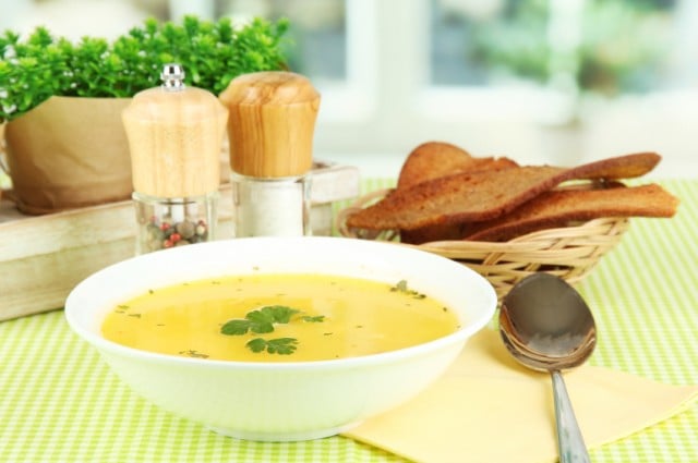 warm chicken broth on a table