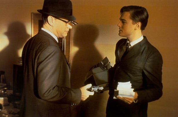 Tom Hanks talks to Leonardo DiCaprio in Catch Me If You Can